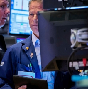 Dow slides nearly 800 points as AI and tariff risks rattle investors