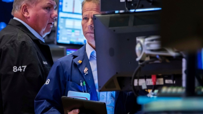 Dow slides nearly 800 points as AI and tariff risks rattle investors