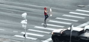 Fire-juggling unicyclist stops Colorado traffic at busy intersection